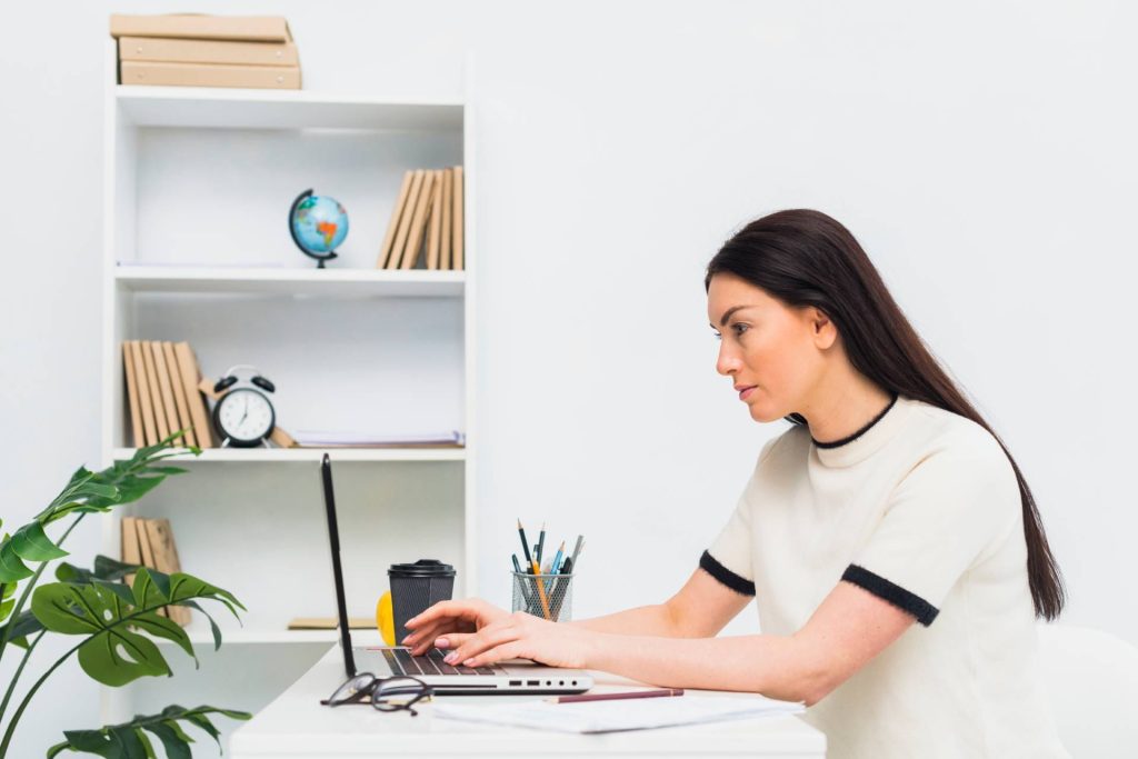 Therapist reviewing appointment booking on a laptop
